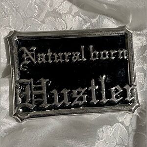 Natural Born Hustler belt buckle, 2.5”x 3.5”Symbolizes determination & ambition